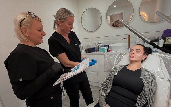 Sarah Whitehead teaching a practitioner during an in-clinic consultation